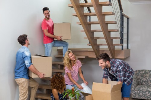 Professional office movers handling furniture in Storage Tooting