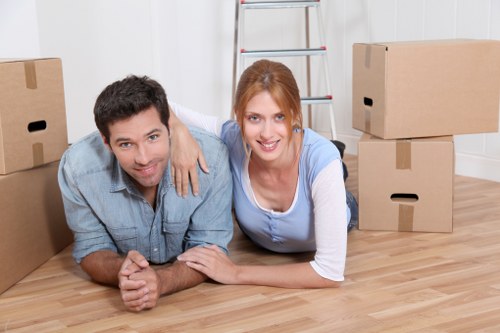 Professional movers assisting with loading a removal truck
